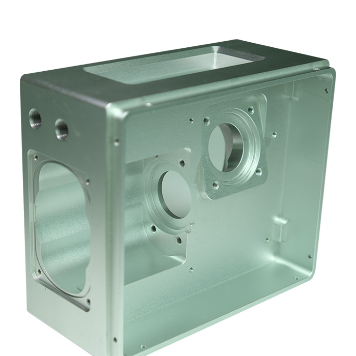 Five-axis CNC milling machine machining connector openings and internal pockets on a one-piece electronics enclosure